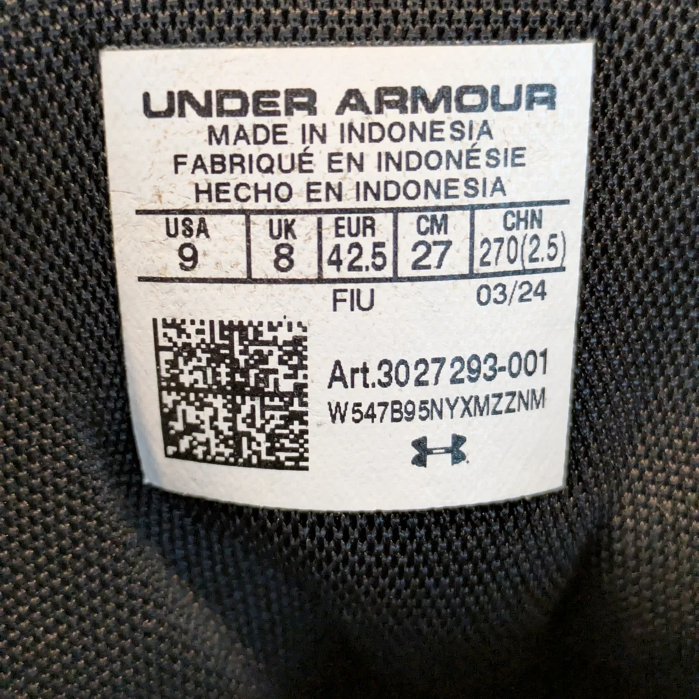 Under Armour Spotlight Franchise 4.0 RM football cleat in black and white.